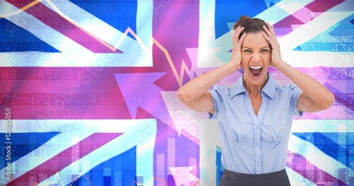 Composite image of stressed businessswoman with hand on her head photo