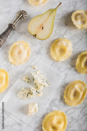 Homemade raviolis filled with gorgonzola and pear photo