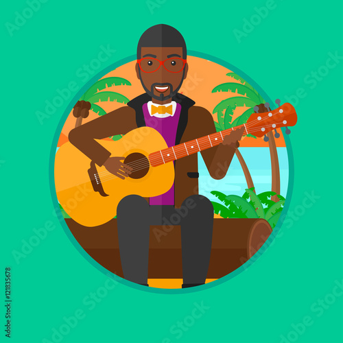 Musician playing acoustic guitar.