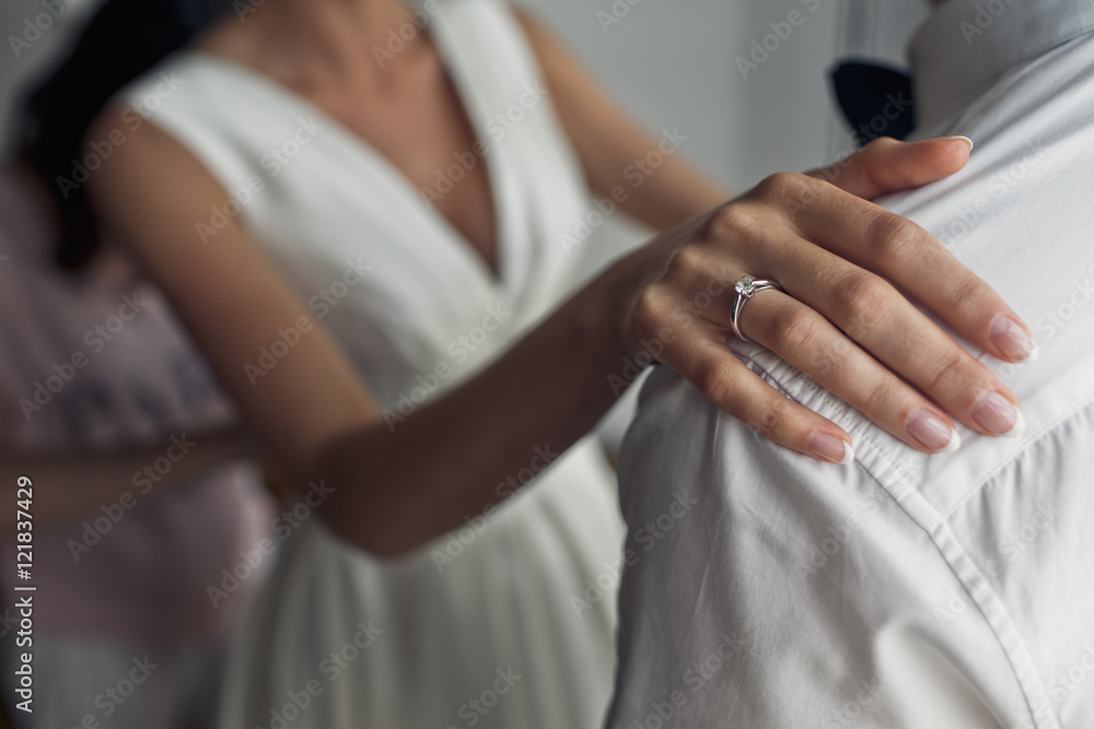 Fototapeta premium The bride wears a wedding dress