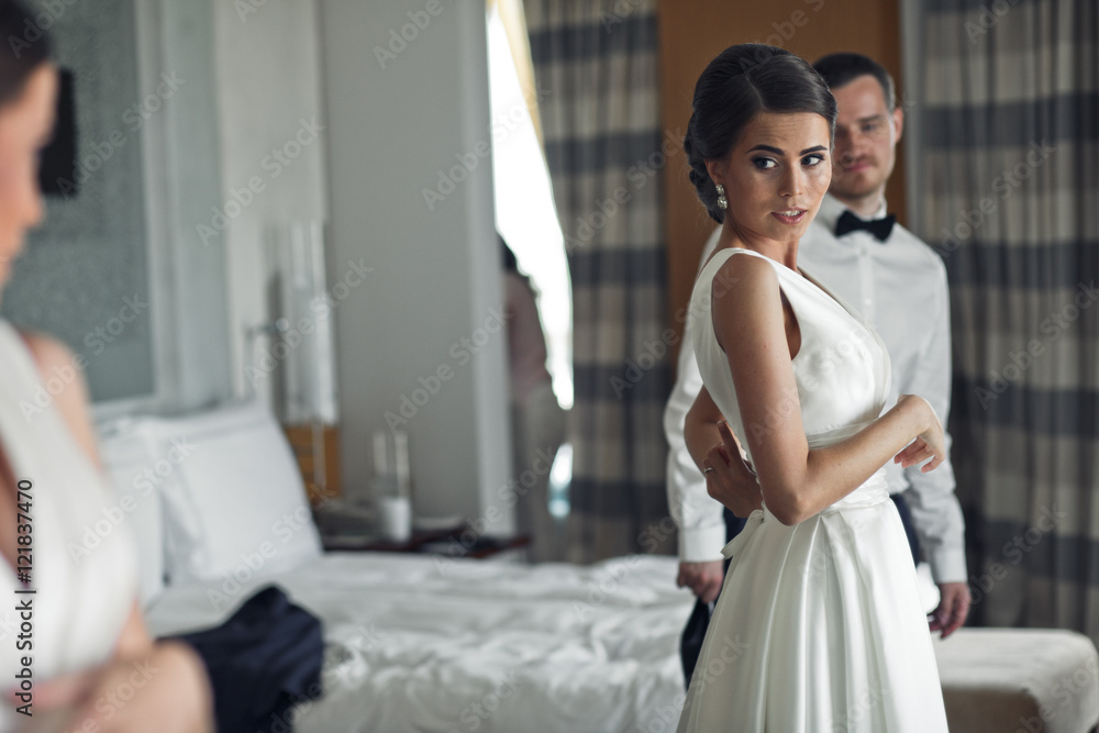 The bride looks at the mirror The bride looks at the mirror
