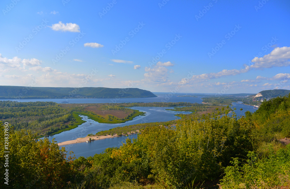 Panoramic view from the hill on the the Volga river near Samara city at sunny day. Beautiful natural landscape. Russia.