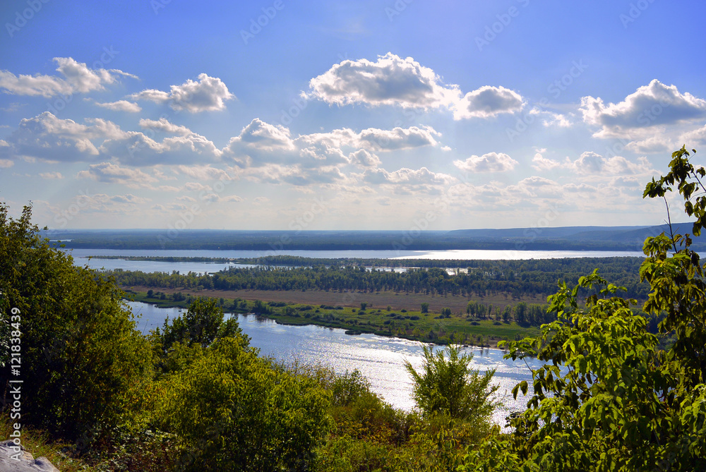Panoramic view from the hill on the the Volga river near Samara city at sunny day. Beautiful natural landscape. Russia.