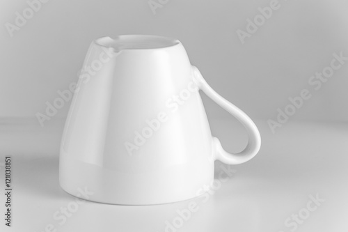 Upside down white coffe cup