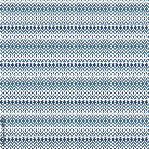 Ethnic pattern background with geometrical elements. Simple repeating geometric texture. Seamless colorful background with triangles in rows.