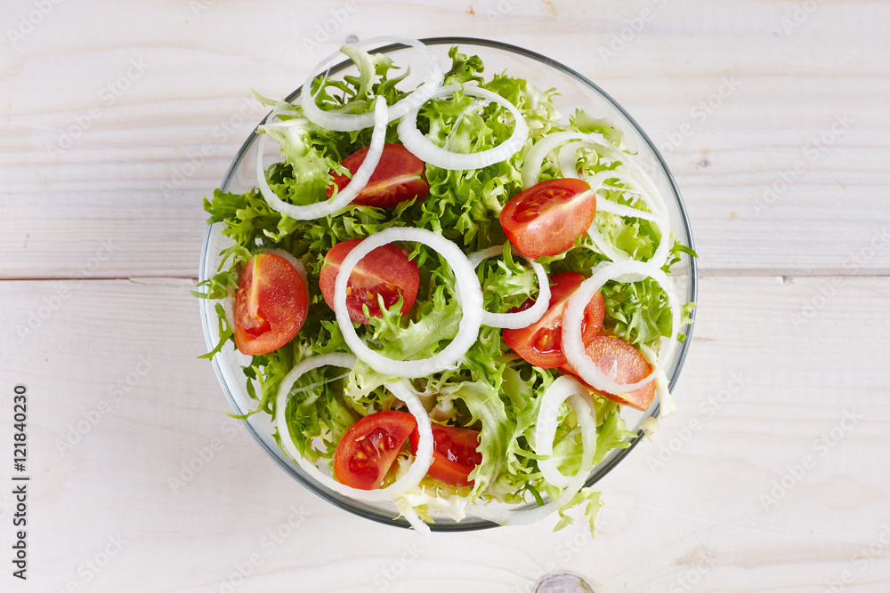 salad on a white wooden table salad on a white wooden table