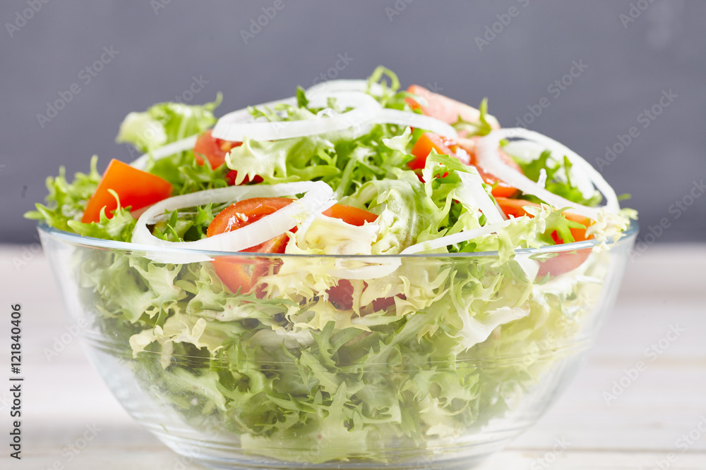 salad on a white wooden table salad on a white wooden table
