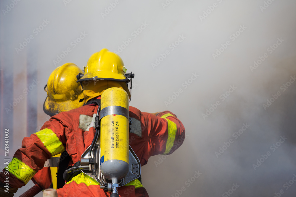 firefighter and rescue team surround with smoke and dust in academy training firefighter and rescue team surround with smoke and dust in academy training