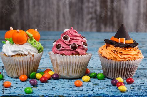 Halloween cupcakes with colored decorations