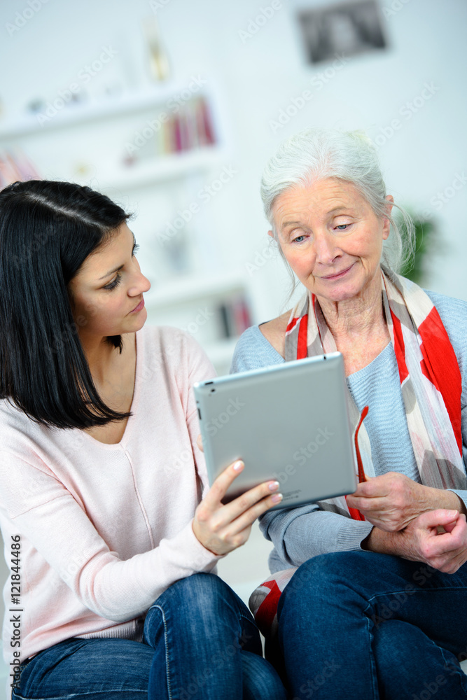 Helping senior woman to read