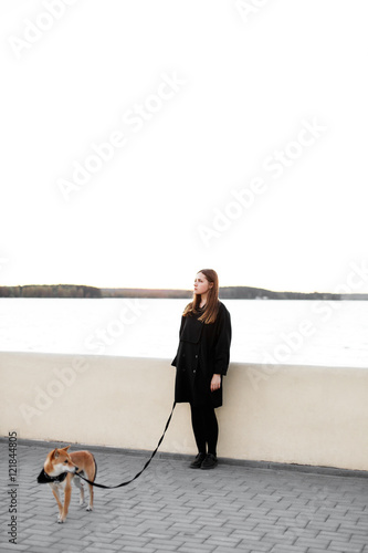 Girl walking with japan dog