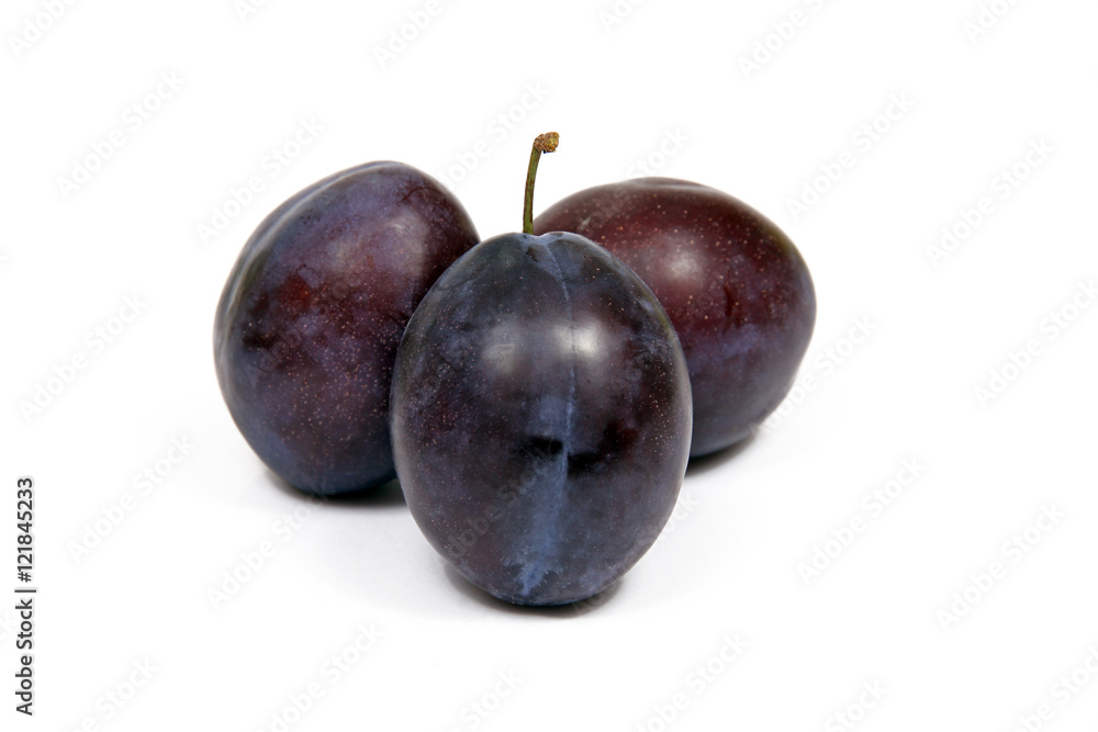 Plums on white background isolated