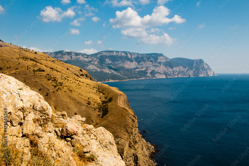 The beach in the Crimea. The rock in the black sea. Beautiful Crimean landscape, on the black sea.