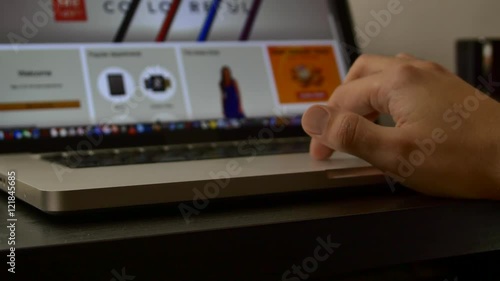 Young Man Surfing The Internet Using The Laptop Track Pad, Detail
