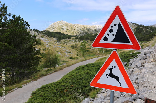 Warning traffic signs in the mountains