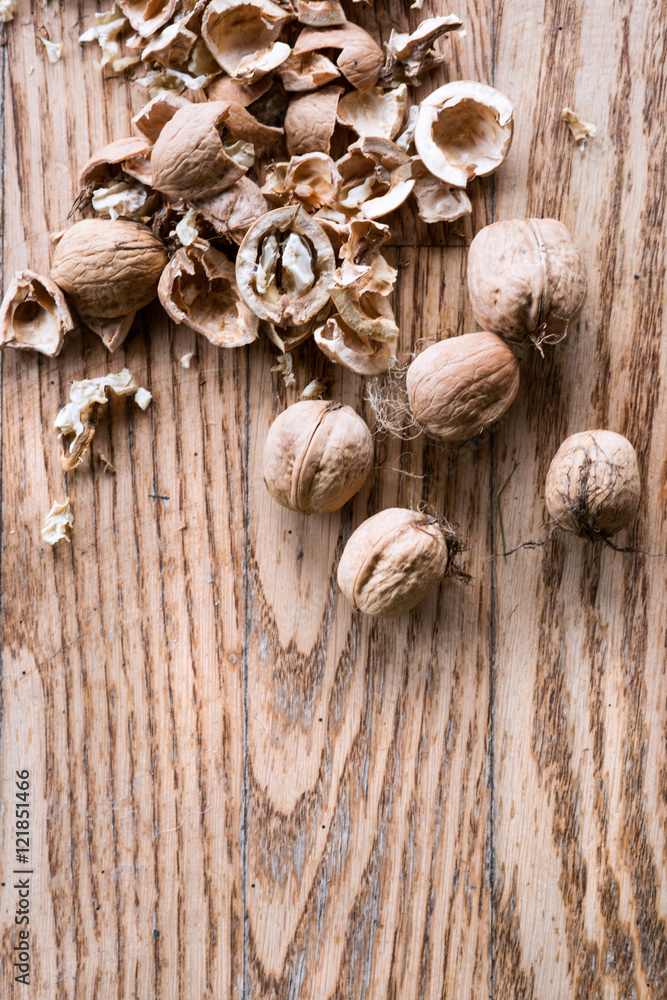 Walnuts on wooden background. Studio shot, copy space.