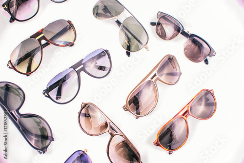 Assorted sunglasses over white background