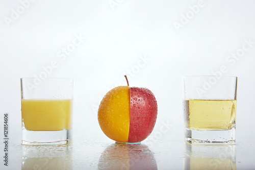 half apple half orange with juices 2 photo