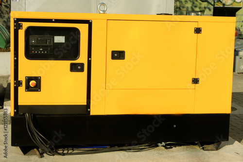 one yellow auxiliary Diesel generator for Emergency Electric Power form the front.