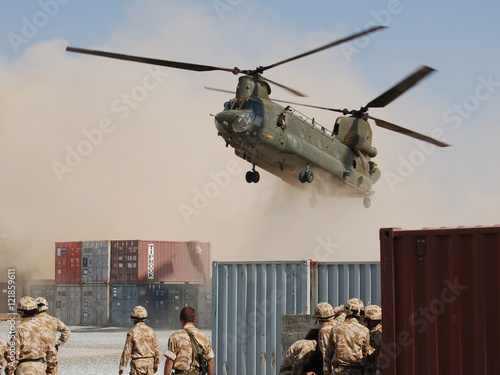 Canvas Print Helicopter Landing at Desert Base