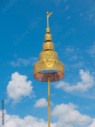 Detail of Golden tiered on decorating the Buddhist temple  in Wat Hin Thaen Lamphachi temple (Temple public) . Kanchanaburi ,Thailand photo