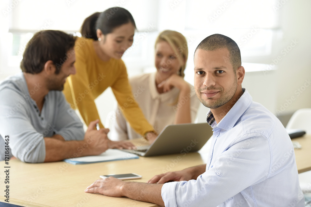Portrait of man attending work meeting