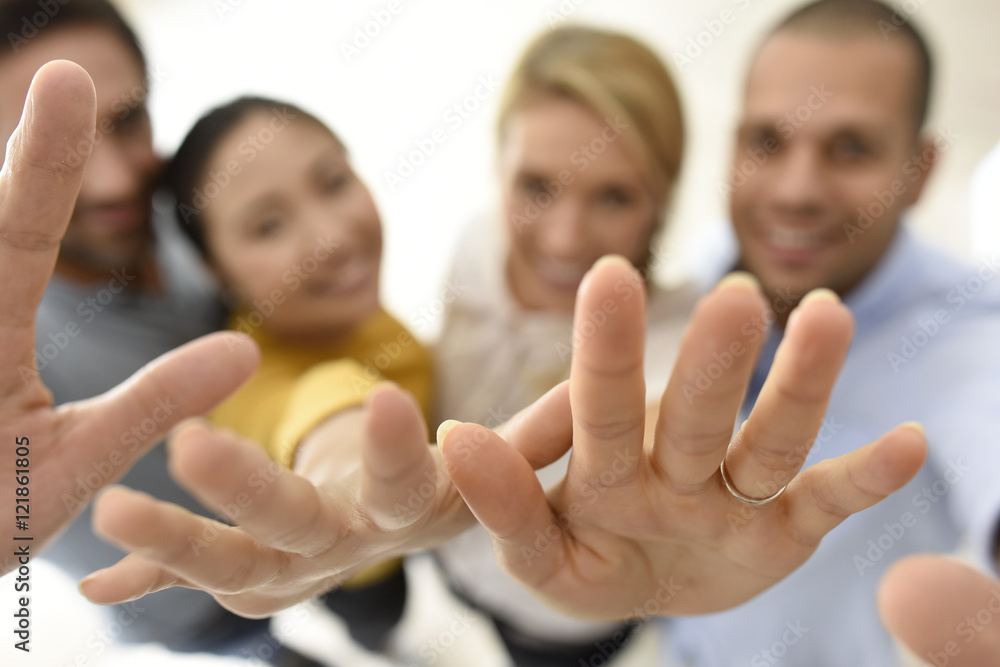 Group of people showing thumbs up to camera Group of people showing thumbs up to camera