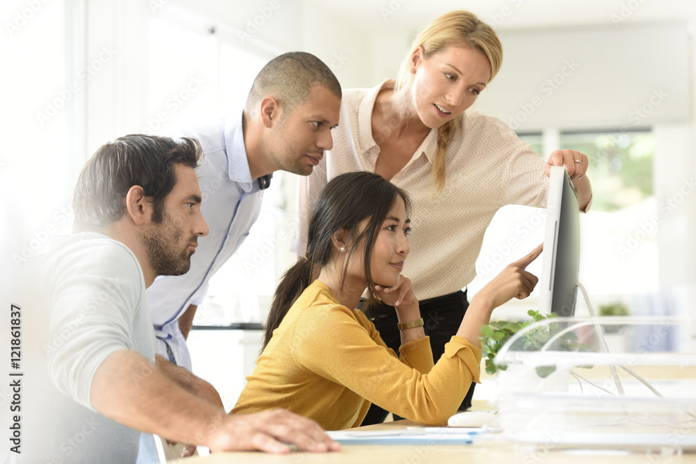 business team working together on desktop business team working together on desktop