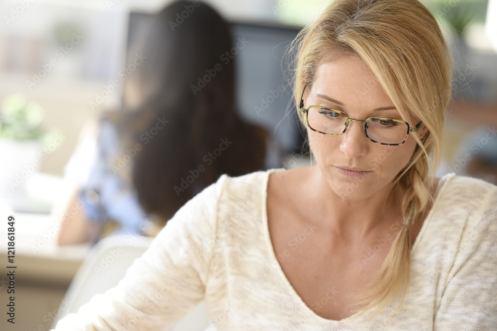 Portrait of office-worker with eyeglasses at work Portrait of office-worker with eyeglasses at work