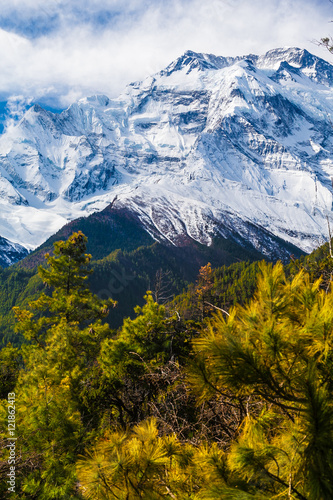 Landscapes Snow Mountains Nature Morning Viewpoint.Mountain Trekking Landscape Background. Nobody photo.Asia Vertial picture. Sunlights White Blue Sky. Himalayas Rocks.