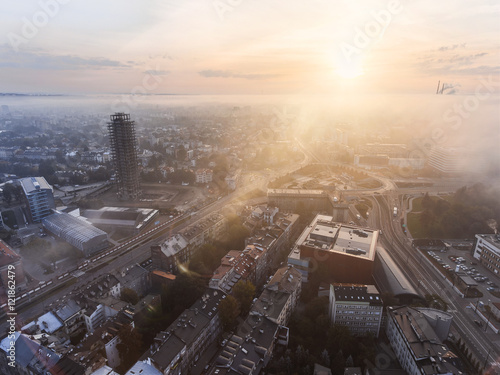 Krakow aerial cityscape from the sky with clouds and fog. Sunrise morning