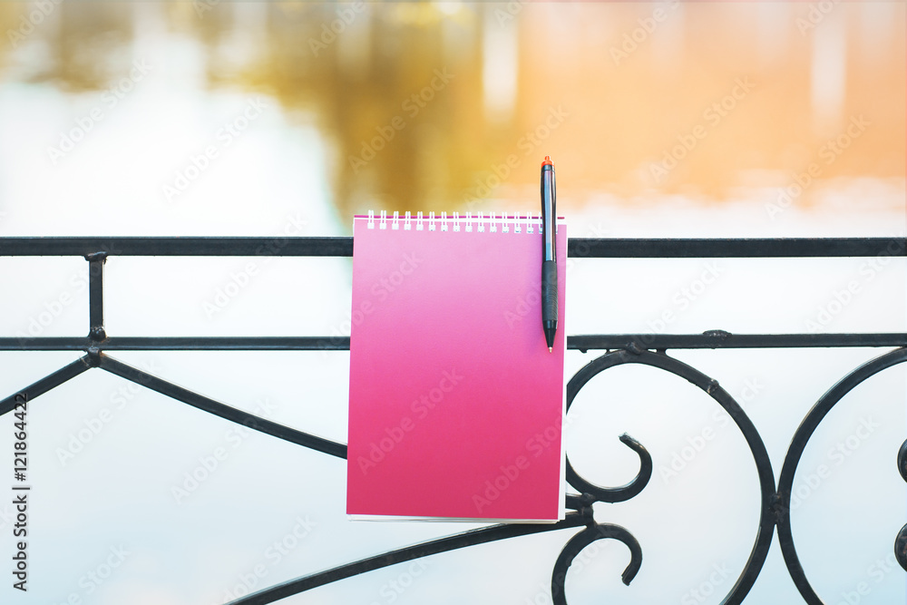 Fototapeta premium lake railing with spiral notepad