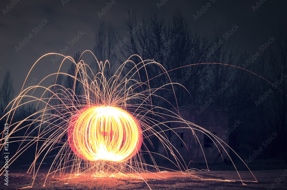 Burning ball of steel wool Stock Photo | Adobe Stock