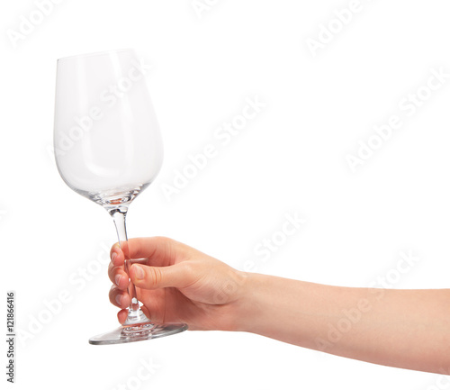Female hand holding empty clean transparent wine glass