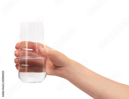 Female hand holding clean drinking glass with water