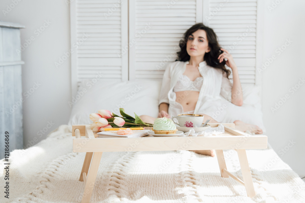 Woman having Breakfast in bed