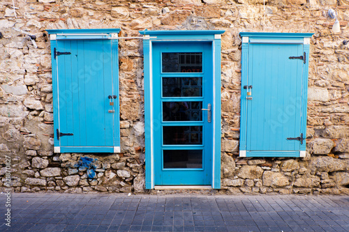 Blue door and windows in a stone house