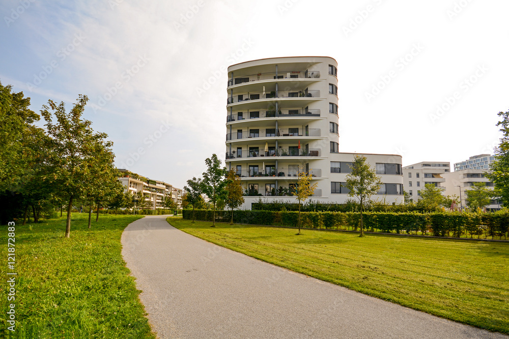 Modern residential tower, apartment building in a new urban development Modern residential tower, apartment building in a new urban development