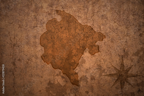 montenegro map on vintage crack paper background