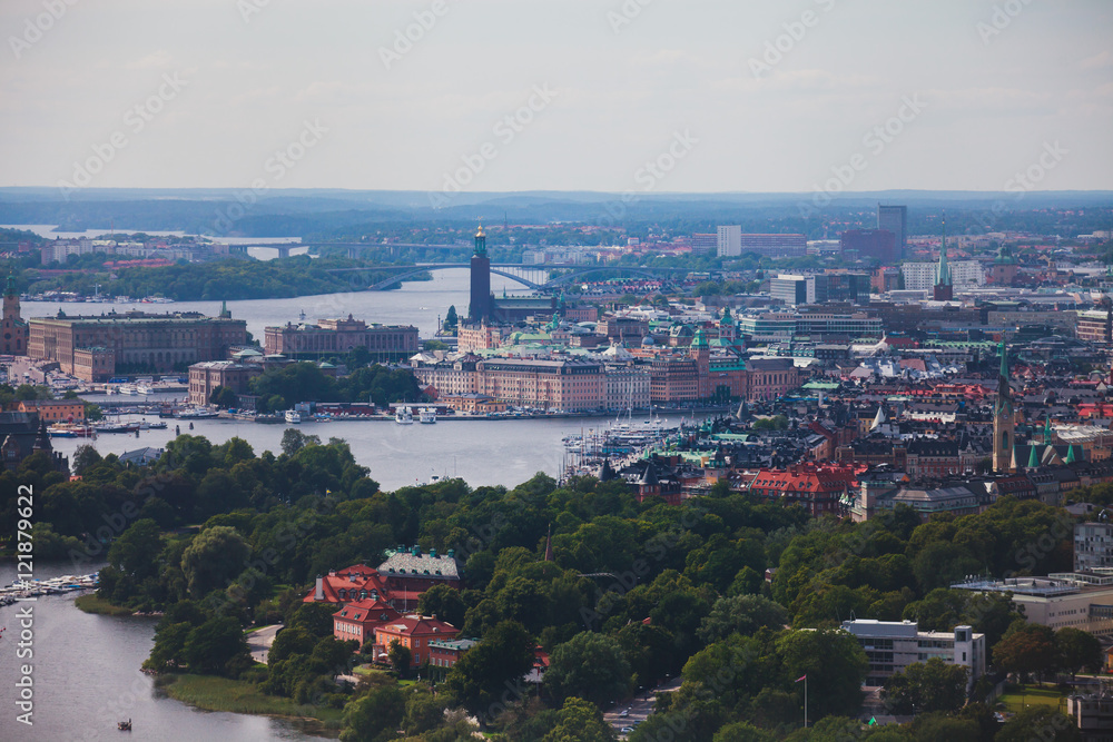 Fototapeta premium Beautiful super wide-angle panoramic aerial view of Stockholm, Sweden with harbor and skyline with scenery beyond the city, seen from the observation tower, sunny summer day with blue sky 