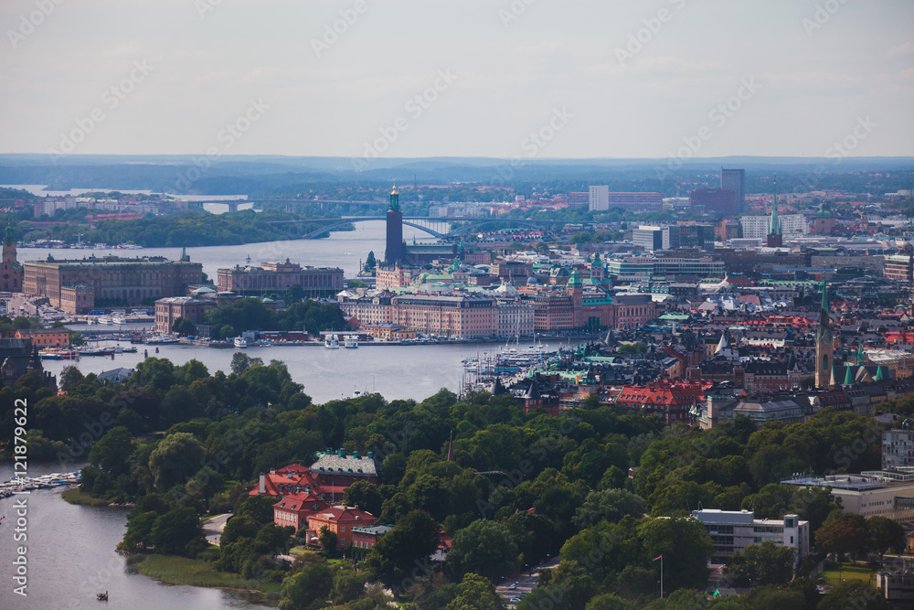 Beautiful super wide-angle panoramic aerial view of Stockholm, Sweden with harbor and skyline with scenery beyond the city, seen from the observation tower, sunny summer day with blue sky
