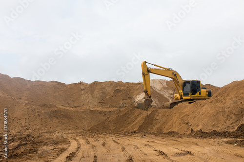 .Backhoe on the sand track.