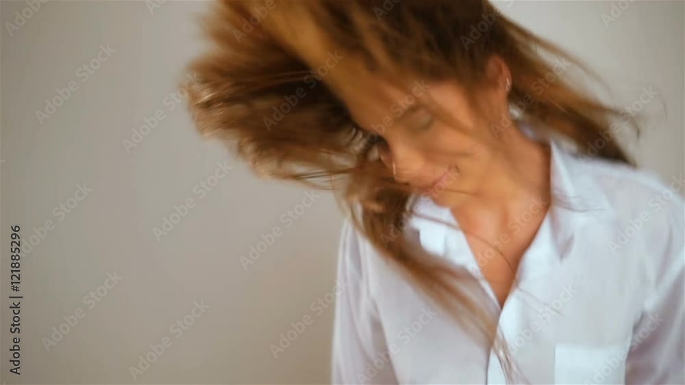 Morning picture of sexy woman dancing on her bedroom at short man shirt,listen music, attractive sexy young girl with long hair in lingerie at morning jumping. Fashion model fun. Morning picture of sexy woman dancing on her bedroom at short man shirt,listen music, attractive sexy young girl with long hair in lingerie at morning jumping. Fashion model fun.