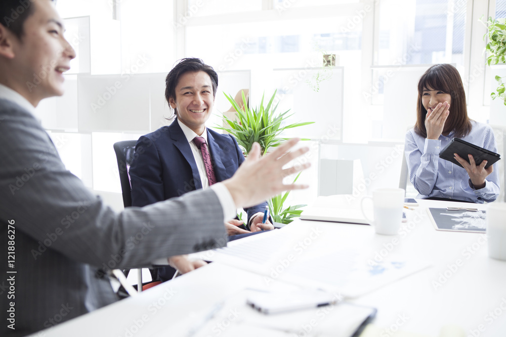 Three businessmen are meeting with a smile Three businessmen are meeting with a smile