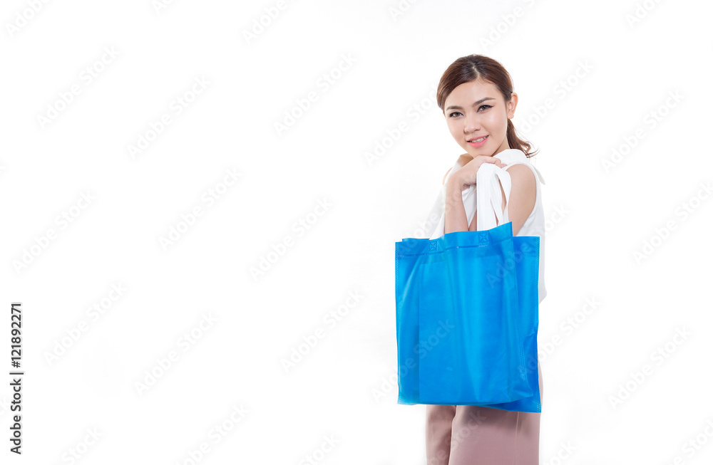Happy asian woman standing , holding shopping bag. Happy asian woman standing , holding shopping bag.