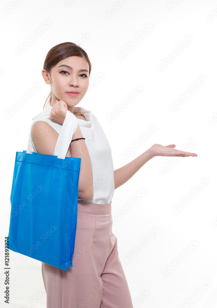 Beautiful Asian woman standing , holding shopping bag. Beautiful Asian woman standing , holding shopping bag.
