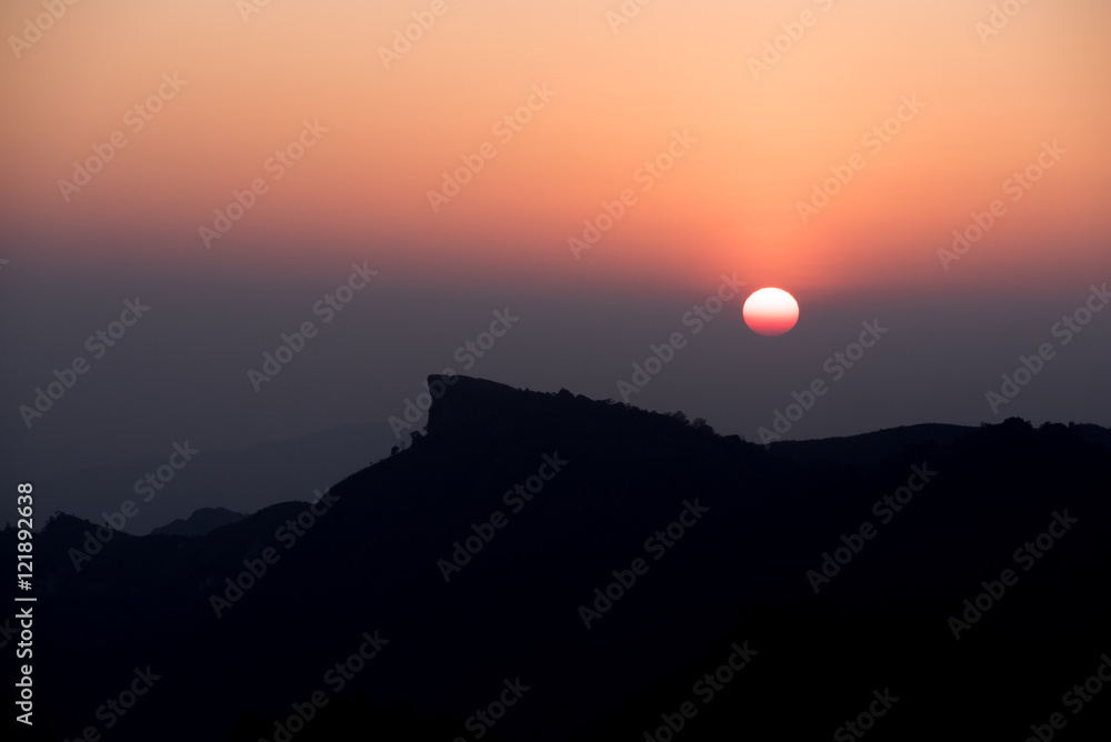 Silluate Photo of Sunset behind the mountains peak