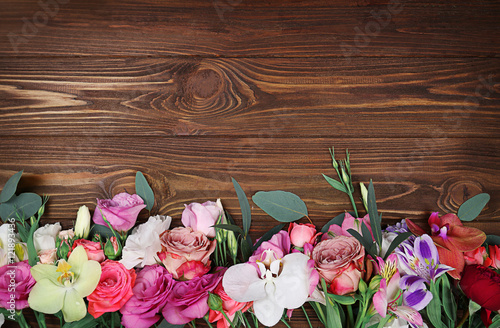 Fresh flowers on  wooden background