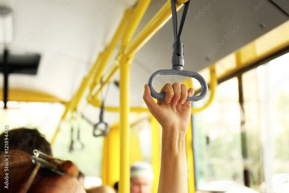 Fototapeta premium Hand holding handle on the public transport