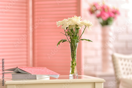 Vase with flowers and books...
